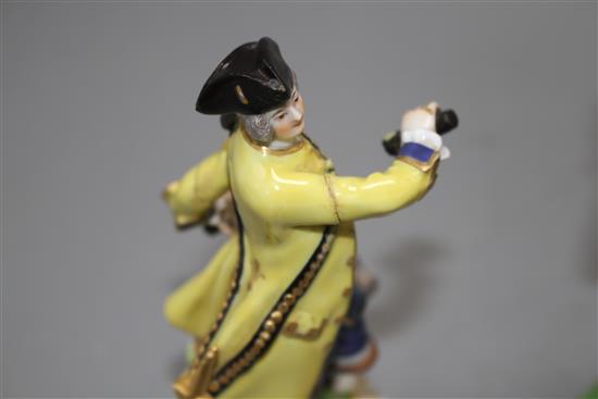 A 19th century Meissen figure of a huntsman and a 19th century English porcelain monkey band figure, 13.5cm and 16cm